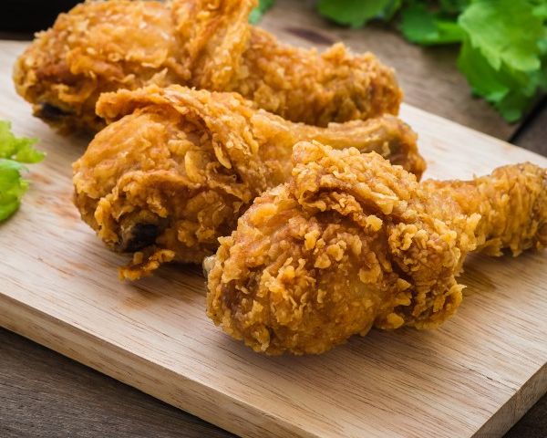 Crispy fried chicken on wooden cutting board and dip sauce